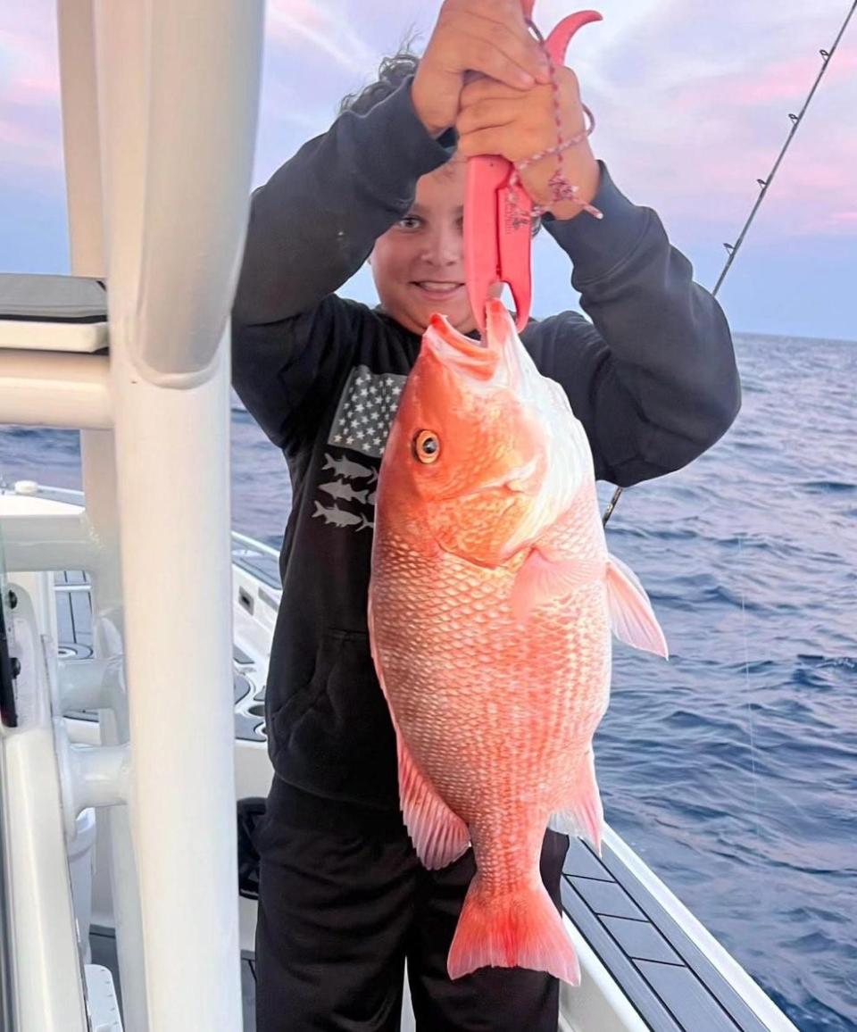 Ray Cardona with a snapper hauled in during last week's two-day bonanza.