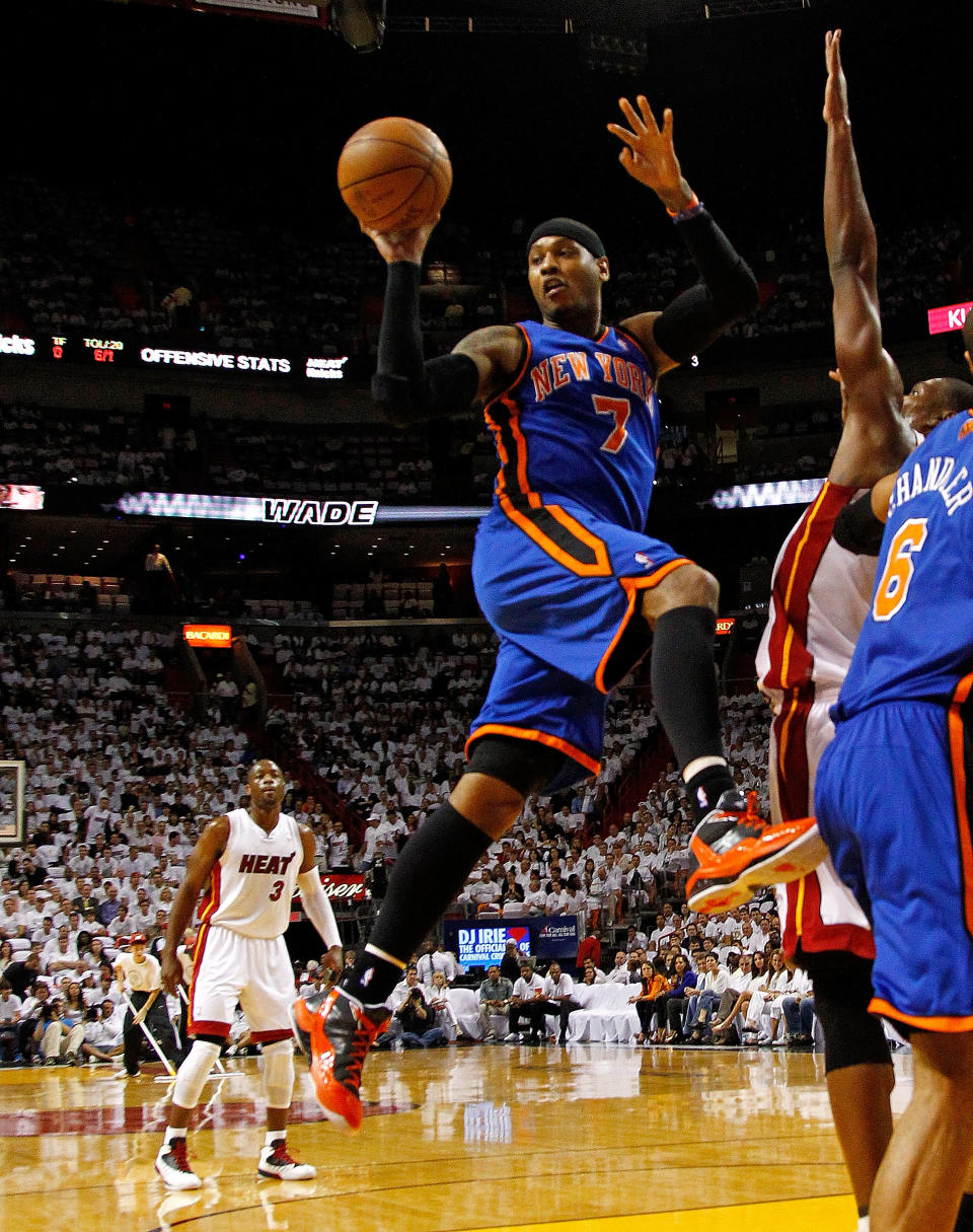 MIAMI, FL - APRIL 30: Carmelo Anthony #7 of the New York Knicks passes during Game Two of the Eastern Conference Quarterfinals in the 2012 NBA Playoffs against the Miami Heatat American Airlines Arena on April 30, 2012 in Miami, Florida. NOTE TO USER: User expressly acknowledges and agrees that, by downloading and/or using this Photograph, User is consenting to the terms and conditions of the Getty Images License Agreement. (Photo by Mike Ehrmann/Getty Images)