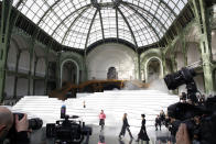 Models wear creations for the Chanel fashion collection during Women's fashion week Fall/Winter 2020/21 presented in Paris, Tuesday, March 3, 2020. (AP Photo/Thibault Camus)