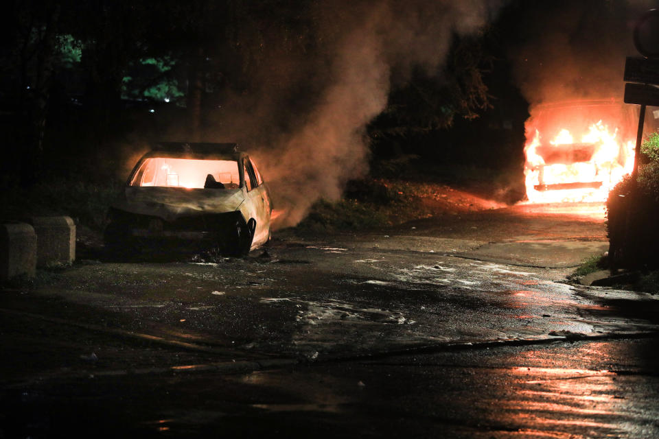 BELGRADE, SERBIA - JULY 8: Burned down vehicles are seen during a protest against new measures to curb the spread of the novel coronavirus (COVID-19) in Belgrade, Serbia on July 8, 2020. Large numbers of people gathered in front of the National Assembly Building in Belgrade after President Aleksandar Vucic announced a weekend curfew in an effort to combat the disease. Protesters clashed with police while attempting to enter the building as gendarmerie forces set up a cordon on the steps in front of its entrance. (Photo by Milos Miskov/Anadolu Agency via Getty Images)