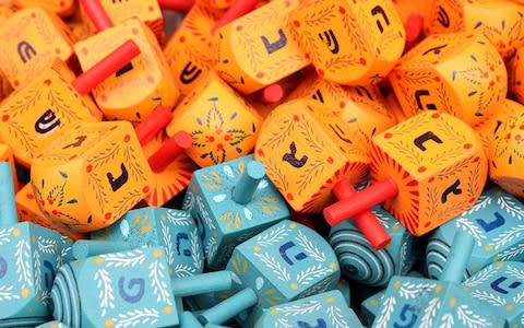 Dreidels for sale at Mahane Yehuda Market in Jerusalem - Credit: Wikimedia Commons