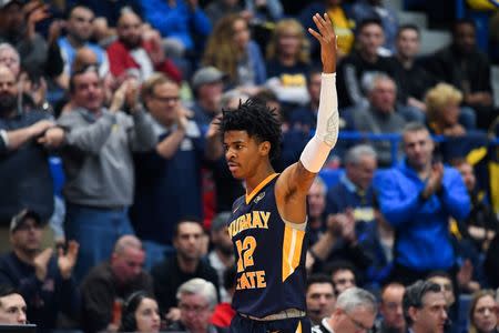 Mar 21, 2019; Hartford, CT, USA; Murray State Racers guard Ja Morant (12) reacts during a time out during the second half of a game against the Marquette Golden Eagles in the first round of the 2019 NCAA Tournament at XL Center. Mandatory Credit: Robert Deutsch-USA TODAY Sports