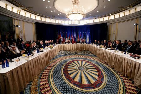 U.S. Secretary of State John Kerry, United Nations secretary general Ban Ki-moon and Russian foreign minister Sergey Lavrov (C) sit with other ministers and delegates at the start a meeting on Syria in New York, December 18, 2015 REUTERS/Jewel Samad/Pool