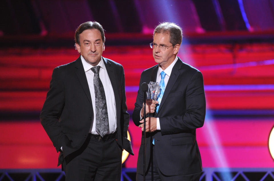 Peter Del Vecho, left, and Chris Buck accept the award for best animated feature for "Frozen" at the 19th annual Critics' Choice Movie Awards at the Barker Hangar on Thursday, Jan. 16, 2014, in Santa Monica, Calif. (Photo by Frank Micelotta/Invision/AP)