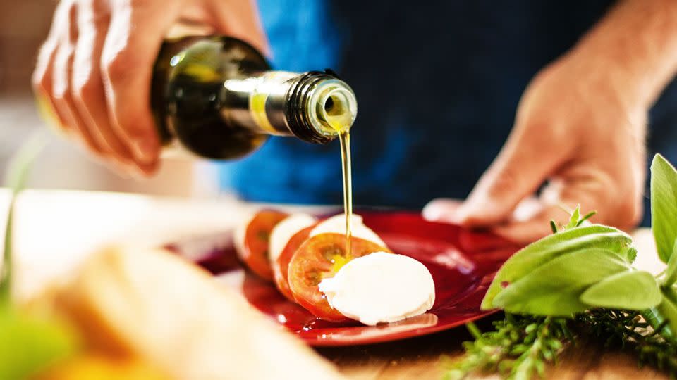 Olive oil can be a healthy, tasty addition to foods such as sandwiches and salads. - knape/E+/Getty Images/File