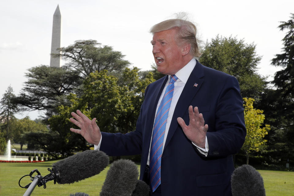 President Donald Trump speaks to reporters before departing the White House in Washington, Friday, Aug. 2, 2019, for the short trip to Andrews Air Force Base and onto his Bedminster, N.J., golf club. (AP Photo/Carolyn Kaster)