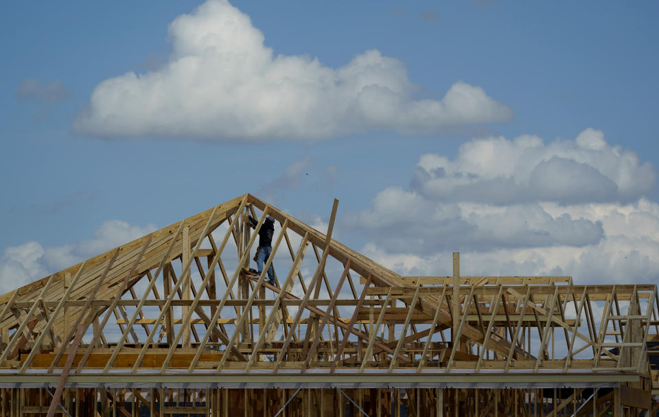 A construction worker helps frame a new home, Friday, Sept. 17, 2021, in McAllen, Texas. As the population of the Rio Grande Valley swells, its water supply is facing distinct challenges. (AP Photo/Eric Gay)