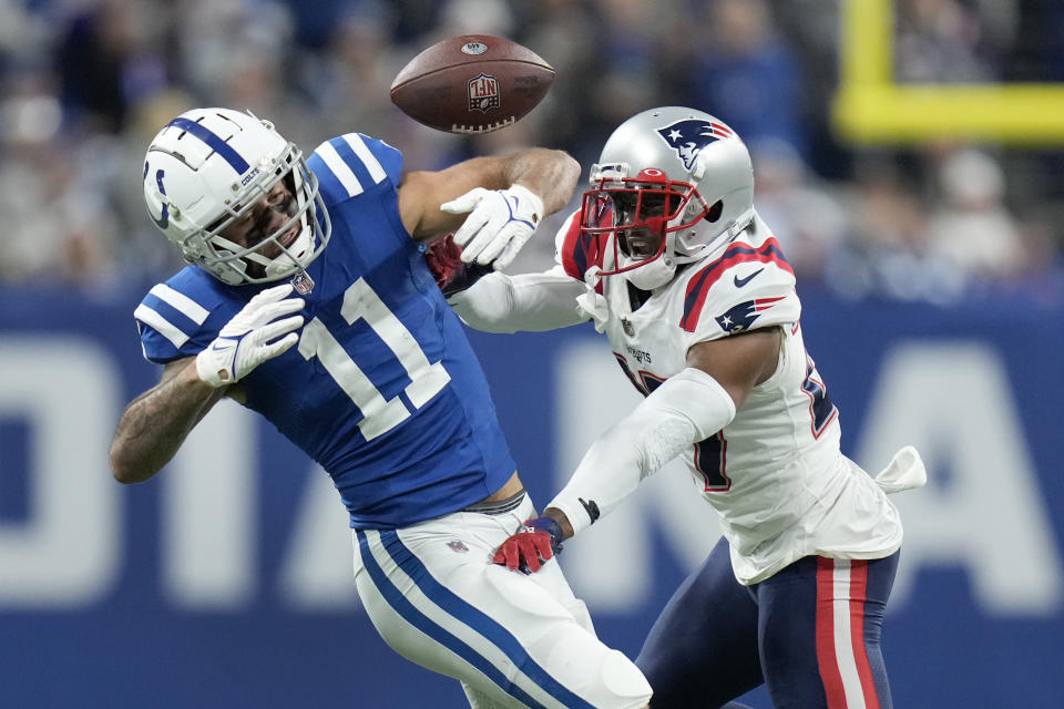 New England Patriots cornerback J.C. Jackson, right, breaks up a pass intended for Indianapolis Colts wide receiver Michael Pittman Jr. (11) during the second half of an NFL football game Saturday, Dec. 18, 2021, in Indianapolis. (AP Photo/AJ Mast)