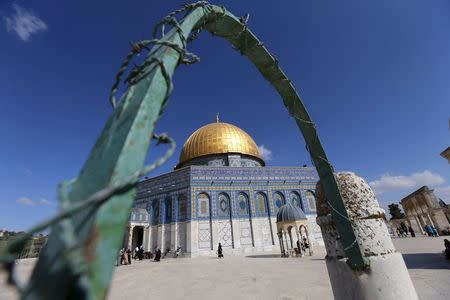 The Dome of the Rock located on the compound known to Muslims as the Noble Sanctuary and to Jews as Temple Mount, is seen through a metal bar in Jerusalem's Old City May 29, 2015. REUTERS/Ammar Awad