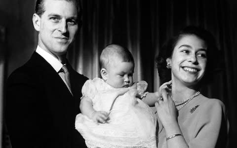 In a photograph dated April 26, 1948, the then Princess Elizabeth and the Duke of Edinburgh are seen holding their first child - Prince Charles - Credit: PA