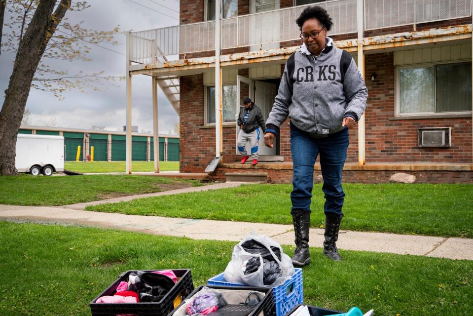 Tonya Hogan, 50, begins to unpack her belongings at her new apartment in Melvindale on Monday, May 1, 2023. Hogan's housing is financially covered through a voucher that requires her to only pay $50 per month of rent.