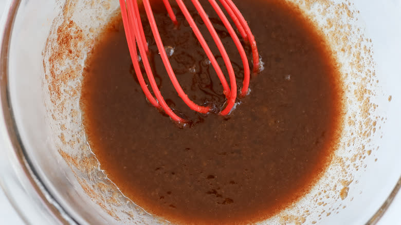 whisking brown sugar and melted butter