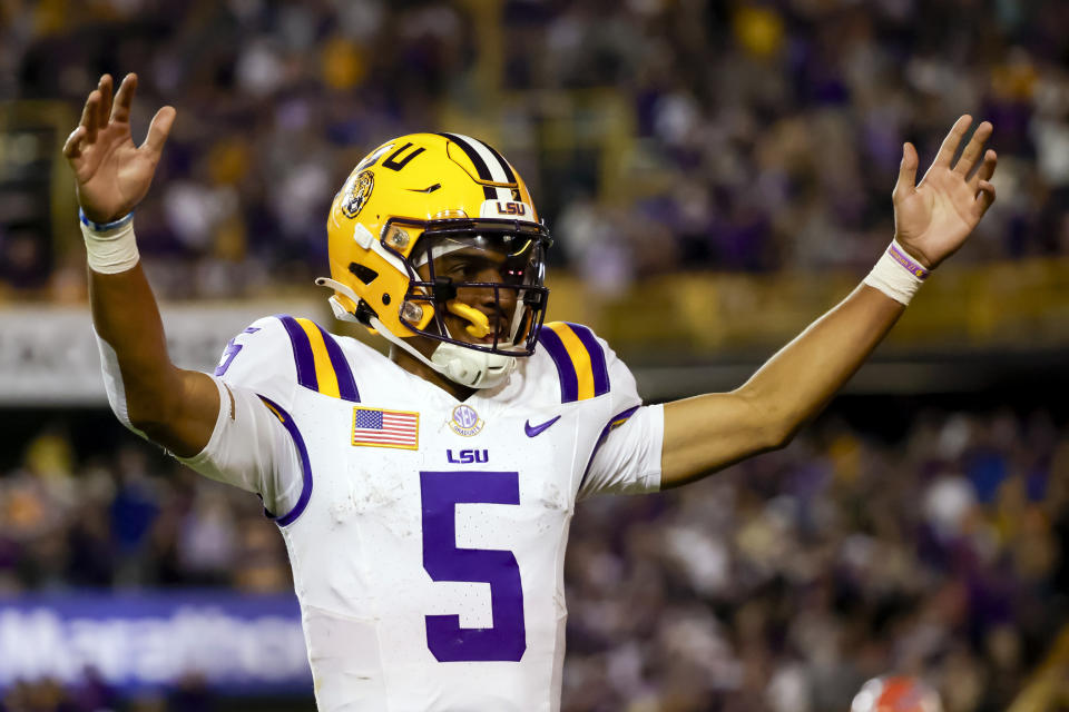 FILE - LSU quarterback Jayden Daniels (5) celebrates after a touchdown against Florida during the second half of an NCAA college football game in Baton Rouge, La., Saturday, Nov. 11, 2023. Daniels is a finalists for the Heisman Trophy.(AP Photo/Derick Hingle, File)