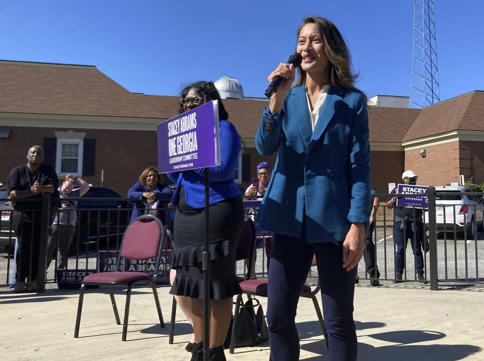 Georgia Democrat Bee Nguyen urges voters to choose her for secretary of state on Thursday, Oct. 27, 2022 in Milledgeville, Ga. Nguyen is trying to persuade voters to reject Republican incumbent Brad Raffensperger, arguing his support for Georgia's voting law and opposition to abortion outweighs his defiance of pressure from President Donald Trump to overturn Georgia's 2020 election results. (AP Photo/Jeff Amy)