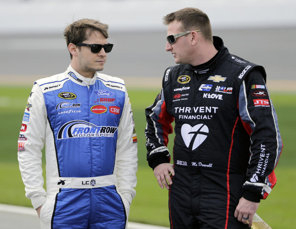 Landon Cassill (L) is being replaced by the man on the right. (AP Photo/Terry Renna, File)