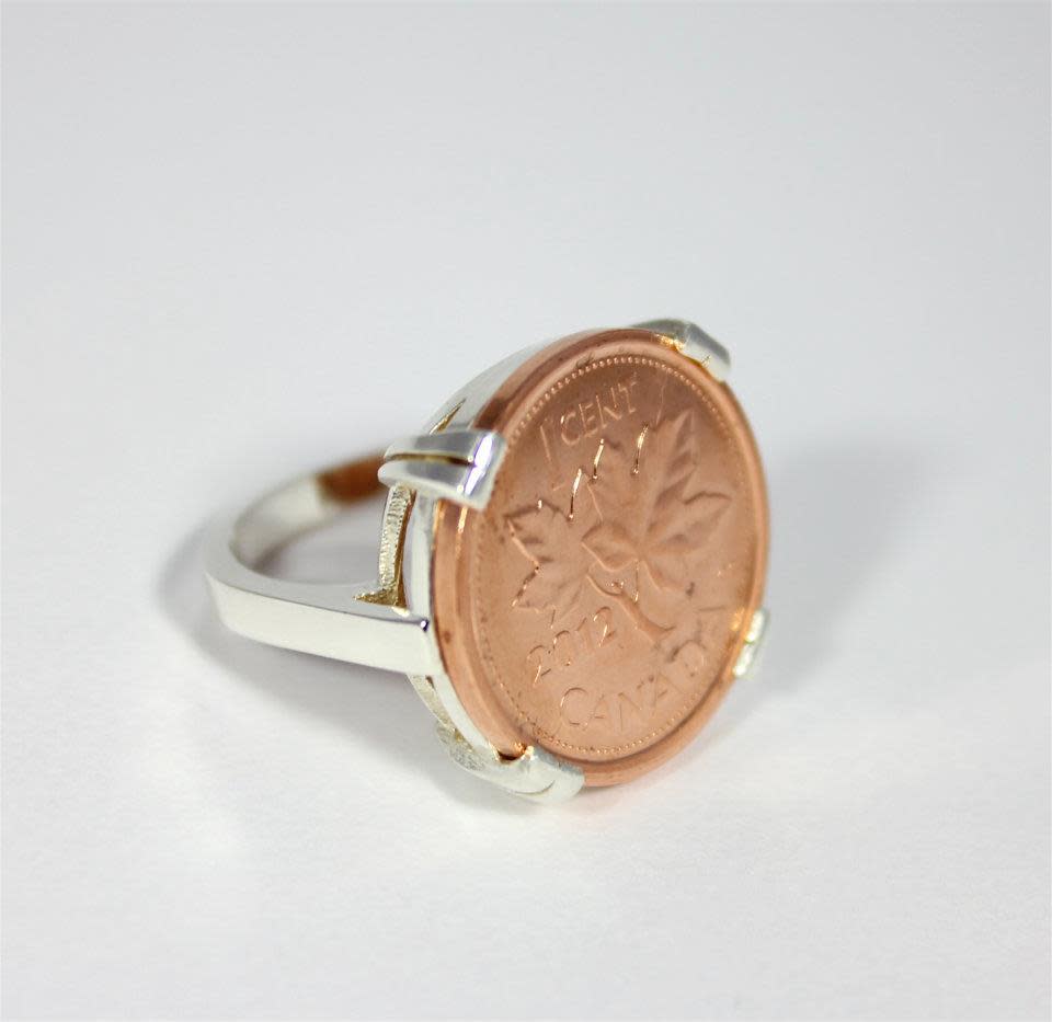 One of the rings displayed on Coin Coin designs & co.'s Facebook page. Renee Gruszecki designs jewelry from coins.