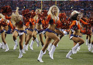 The Denver Broncos cheerleaders perform during the first half of an NFL preseason football game against the Seattle Seahawks.