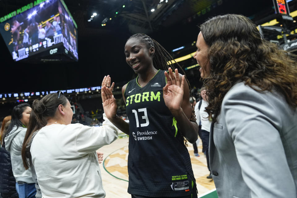 Seattle Storm center Ezi Magbegor is greeted by general manager Talisa Rhea, right, as she leaves the court after the team's 80-62 win over the Phoenix Mercury in a WNBA basketball game Tuesday, June 4, 2024, in Seattle. (AP Photo/Lindsey Wasson)