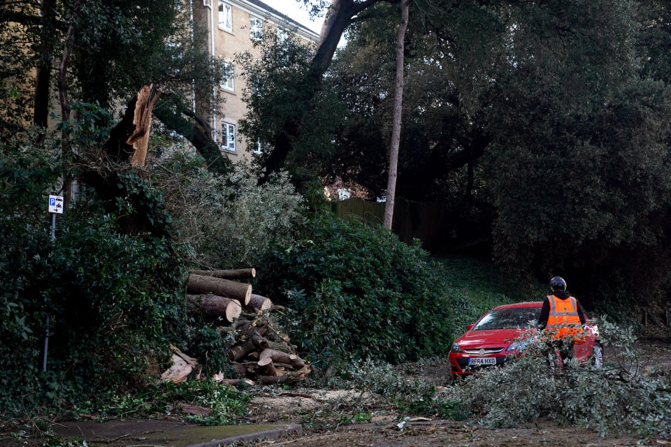 Fallen trees being cleared off the road in Bournemouth, Dorset. (PA)