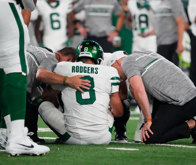 NFL instant replay images: Aaron Rodgers suffers ankle injury on Jets'  first drive