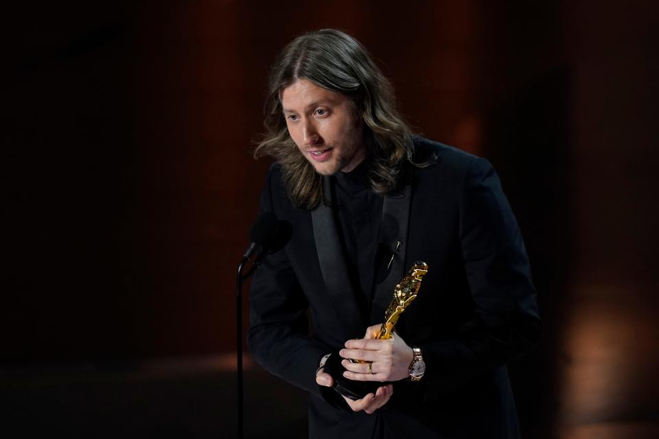 Ludwig Göransson accepts the award for best original score for "Oppenheimer" during the 96th Oscars at the Dolby Theatre at Ovation Hollywood in Los Angeles on March 10, 2024.