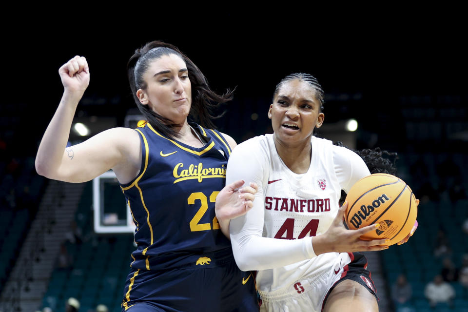 Stanford forward Kiki Iriafen (44) drives past California forward Claudia Langarita, left, during the second half of an NCAA college basketball game in the quarterfinal round of the Pac-12 tournament Thursday, March 7, 2024, in Las Vegas. (AP Photo/Ian Maule)