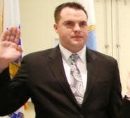 Andrew Keenan is sworn in as a Quincy police officer in 2014.