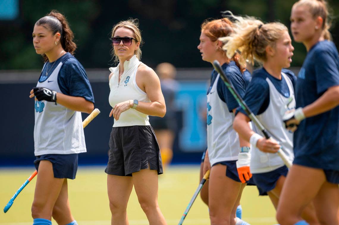 North Carolina field hockey coach Erin Matson watches her team as they warm up for their game against Iowa on Sunday, August 27, 2023 at Karen Shelton Stadium in Chapel Hill, N.C.