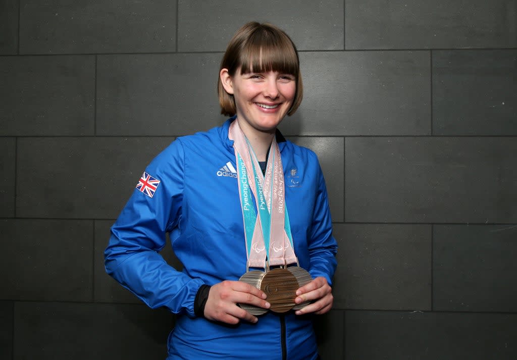 Millie Knight poses with her medals after arriving back from the PyeongChang 2018 Paralympic Winter Games (Getty Images)
