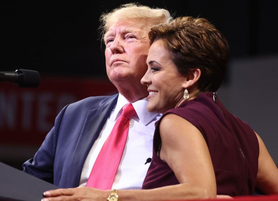 <div class="inline-image__caption"><p>Former President Donald Trump (L) embraces Republican candidate for governor Kari Lake at a “Save America” rally in support of Arizona GOP candidates on July 22, 2022, in Prescott Valley, Arizona. </p></div> <div class="inline-image__credit">Mario Tama/Getty</div>