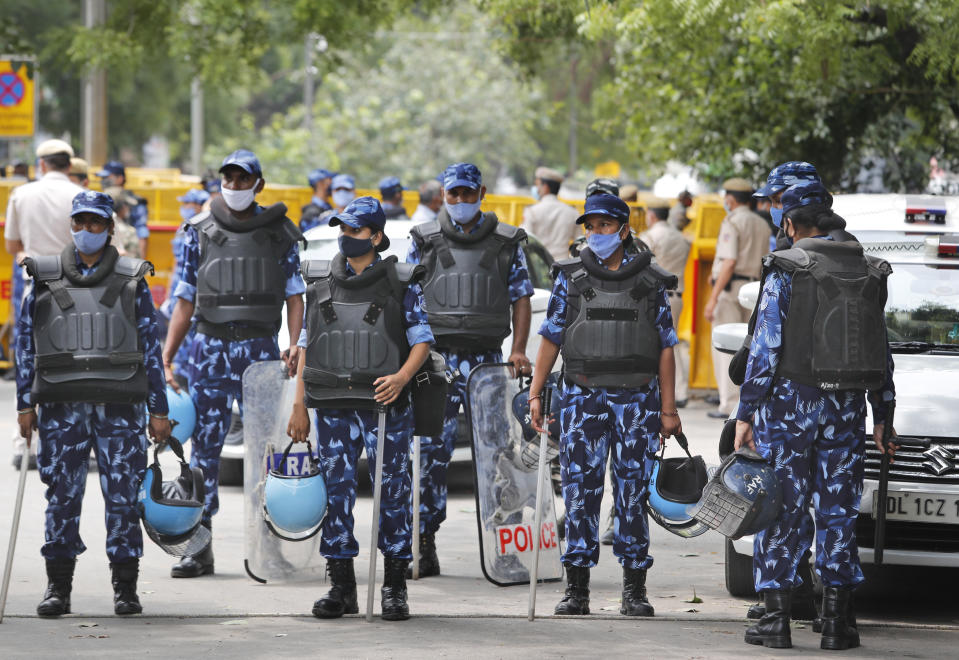 Indian policemen stand guard at farmers protest site in New Delhi, India, Thursday, July 22, 2021. More than 200 farmers on Thursday began a protest near India's Parliament to mark eight months of their agitation against new agricultural laws that they say will devastate their income. (AP Photo/Manish Swarup)