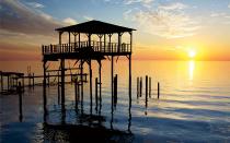 <p>One of my favorite places in the world is Point Clear, Alabama. It’s all 100-year-old houses and beautiful oak trees with Spanish moss. We stay in the same house year after year. It’s on the Gulf of Mexico, and the sun sets right outside our doorstep. You can just sit and watch the pelicans scooping into the water. It’s a true getaway.</p>