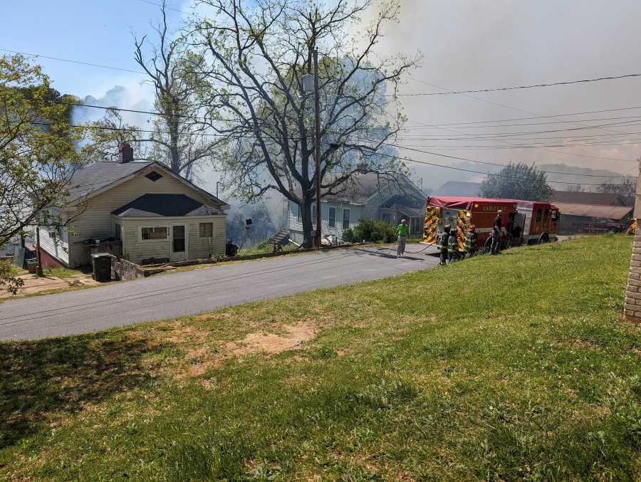 Brush fire burning behind homes on Dunklin Street and Low Avenue in Easley, S.C., April 15, 2024 (WSPA Photo)