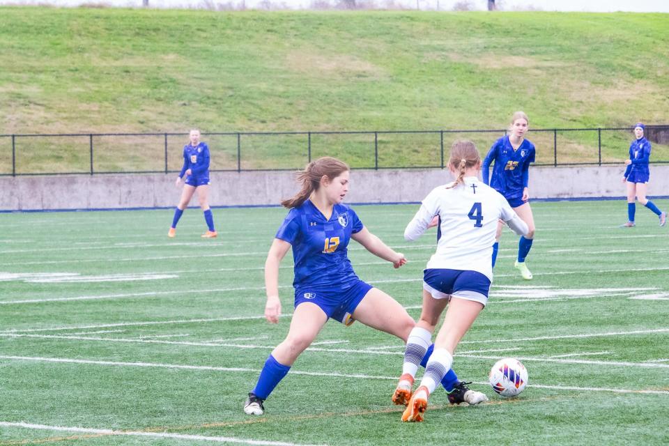 Ripon Christian's Kate Vander Veen (leftL kicks the ball away from Peyton Shaw (right) during the SJS Championship game at Cosumnes River College in Sacramento, CA on Sat. Feb. 17, 2024.