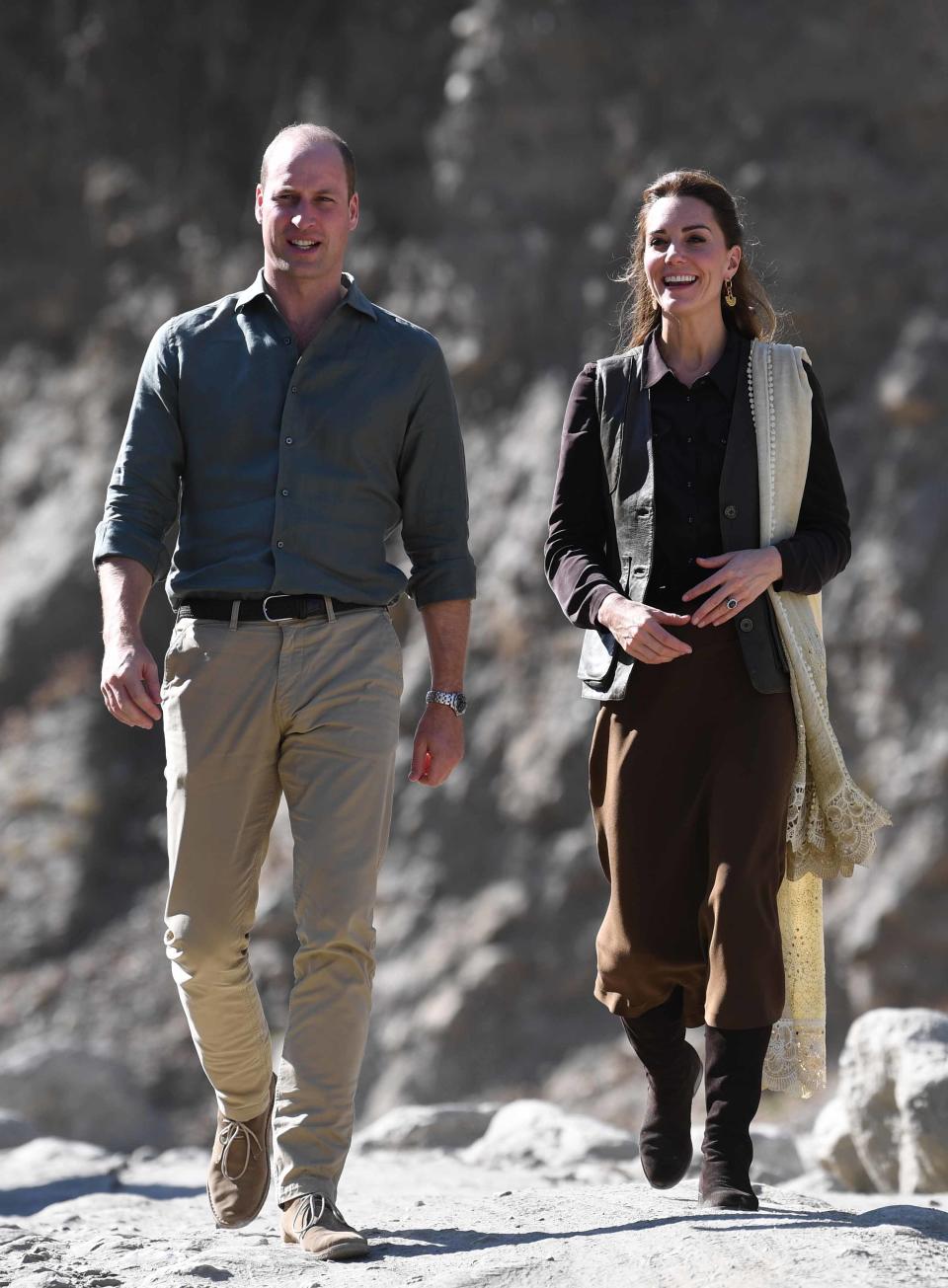 On the third day of the tour, the Cambridges traveled to northern Pakistan. Middleton wore a brown skirt and blouse, with <a href="https://www.reallywildclothing.com/footwear/boots/spanish-leather-boots/spanish-boots-chocolate-suede" rel="nofollow noopener" target="_blank" data-ylk="slk:suede boots;elm:context_link;itc:0;sec:content-canvas" class="link ">suede boots</a> and a <a href="https://www.reallywildclothing.com/us/nubuck-waistcoat-dark-brown" rel="nofollow noopener" target="_blank" data-ylk="slk:nubuck waistcoat;elm:context_link;itc:0;sec:content-canvas" class="link ">nubuck waistcoat</a> by Really Wild—all in shades of brown.