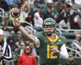 Baylor quarterback Blake Shapen throws a pass in the second half of an NCAA college football game against Texas Tech, Saturday, Nov. 27, 2021, in Waco, Texas. (AP Photo/Jerry Larson)