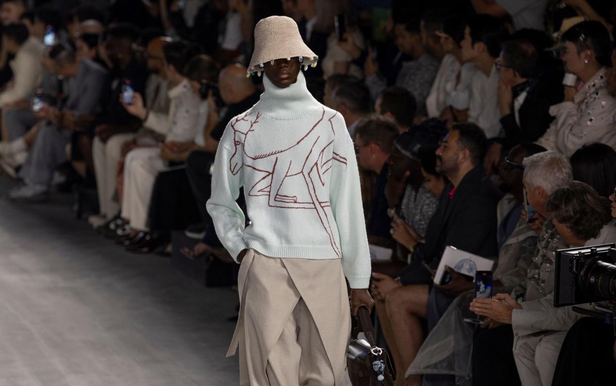 Male model on the runway in new Dior collection for Men's fashion week in Paris