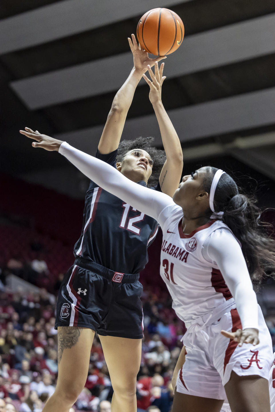 South Carolina guard Brea Beal (12) shoots over Alabama center Jada Rice (31) during the second half of an NCAA college basketball game, Sunday, Jan. 29, 2023, in Tuscaloosa, Ala. (AP Photo/Vasha Hunt)