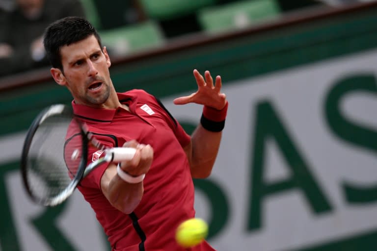 Novak Djokovic returns the ball to Britain's Aljaz Bedene during their men's third round match at the French Open in Paris on May 28, 2016