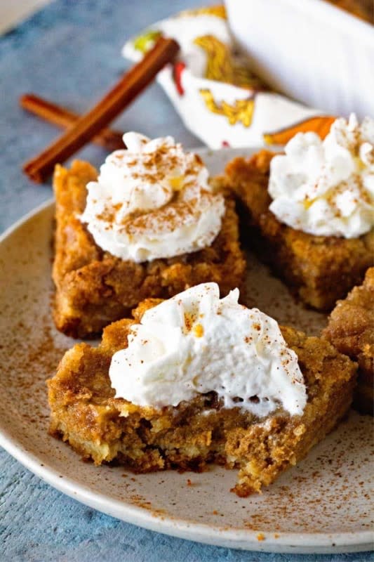 <p>Julie's Eats and Treats</p><p>A delicious cake batter crust, creamy pumpkin pie filling layer and topped with more cake mix? These are the best pumpkin dessert bars! </p><p><strong>Get the recipe: <em><a href="https://www.julieseatsandtreats.com/orgasmic-pumpkin-bars/" rel="nofollow noopener" target="_blank" data-ylk="slk:Pumpkin Dessert Bars;elm:context_link;itc:0;sec:content-canvas" class="link rapid-noclick-resp">Pumpkin Dessert Bars</a></em></strong></p>