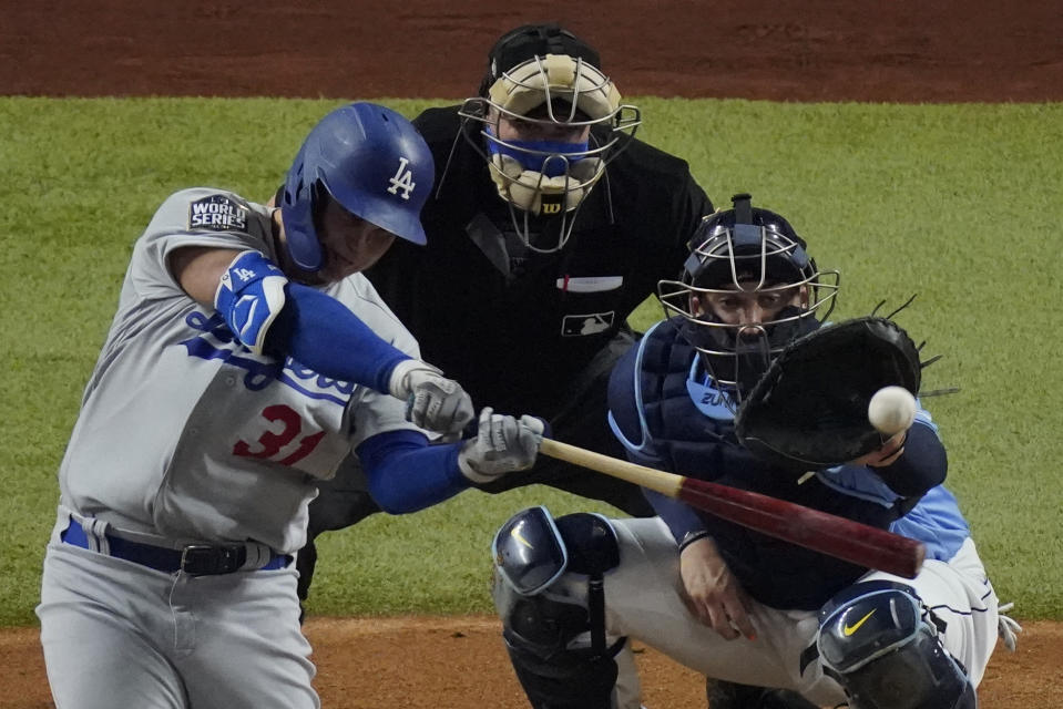 Los Angeles Dodgers' Joc Pederson hits home run against the Tampa Bay Rays during the second inning in Game 5 of the baseball World Series Sunday, Oct. 25, 2020, in Arlington, Texas. (AP Photo/Sue Ogrocki)