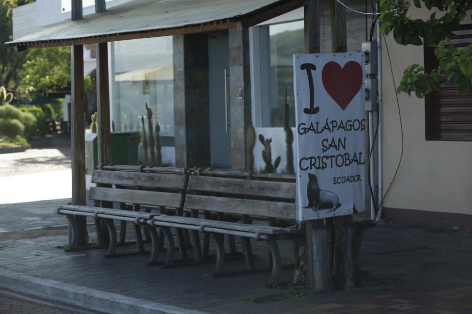 In this May 2, 2020 photo, a pick up point for tourists sits empty amid the new coronavirus pandemic, in San Cristobal, Galapagos Islands, Ecuador. How soon the Galapagos Islands might be able to reopen is unclear. Ecuador's government is allowing for a gradual opening in three stages. But the final stage is not a full return to normal and does not call for resuming national or international flights. (AP Photo/Adrian Vasquez)