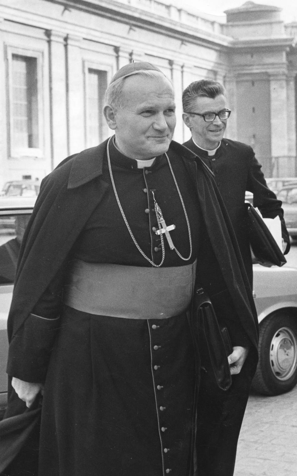 FILE - Karol Cardinal Wojtyla, archbishop of Krakow, Poland, foreground, arrives to take part in Oct. 22, 1971 working session of the World Synod of Bishops at the Vatican. Pope St. John Paul II knew about sexual abuse of children by priests under his authority and sought to conceal it when he was an archbishop in his native Poland, according to a television news report. In a story that aired late Monday, March 6, 2023, Polish channel TVN24 named three priests whom the future pope then known as Archbishop Karol Wojtyla had moved among parishes during the 1970s, including one who was sent to Austria, after they were accused of abusing minors. (AP Photo/Gianni Foggia)