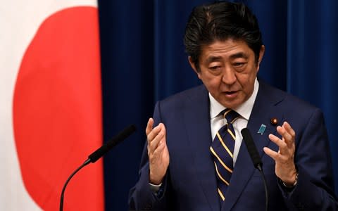 Japan's Prime Minister Shinzo Abe answers a question during a press conference at his official residence in Tokyo - Credit: AFP