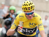 Cycling - The 104th Tour de France cycling race - The 103-km Stage 21 from Montgeron to Paris Champs-Elysees, France - July 23, 2017 - Team Sky rider and yellow jersey Chris Froome of Britain holds a glass of champagne after the start. REUTERS/Benoit Tessier
