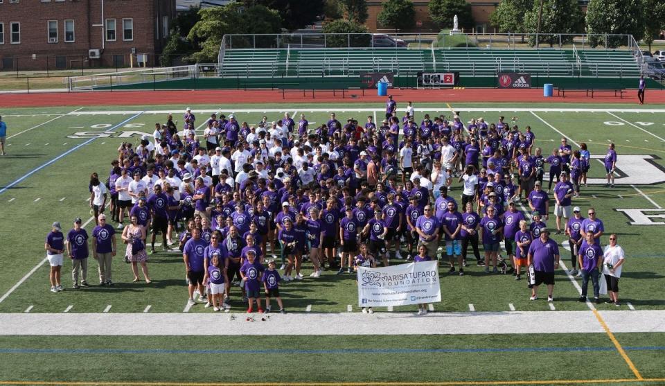 A group shot of the walkers at the Tournament of Roses Parade Charity Walk at St. Joseph High School on July 19, 2022