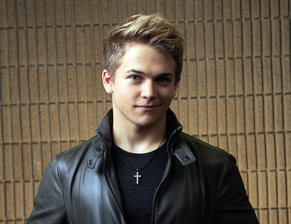 FILE - This March 8, 2012 file photo shows Hunter Hayes in Nashville, Tenn. The 21-year-old Louisiana native is up for three trophies at the Feb. 10 Grammy Awards in Los Angeles, including all-genre award best new artist. The nominations punctuate a period of great growth for Hayes in the 18 months since he released that album. He scored his first No. 1 with "Wanted," becoming the youngest solo male country performer to top the chart. And he began to play in front of larger crowds on tour with several established stars, including Carrie Underwood. (AP Photo/Mark Humphrey, file)