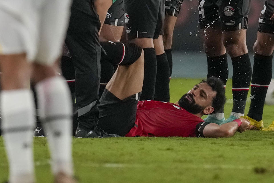 Egypt's Mohamed Salah receives medical treatment during the African Cup of Nations Group B soccer match between Egypt and Ghana in Abidjan, Ivory Coast, Thursday, Jan.18, 2024. (AP Photo/Themba Hadebe)