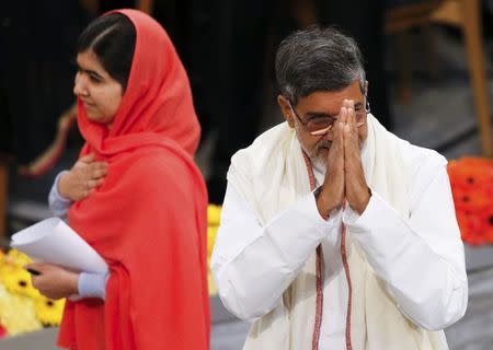 Nobel Peace Prize laureates Malala Yousafzai (L) and Kailash Satyarthi arrive for the Nobel Peace Prize awards ceremony at the City Hall in Oslo December 10, 2014. REUTERS/Suzanne Plunkett