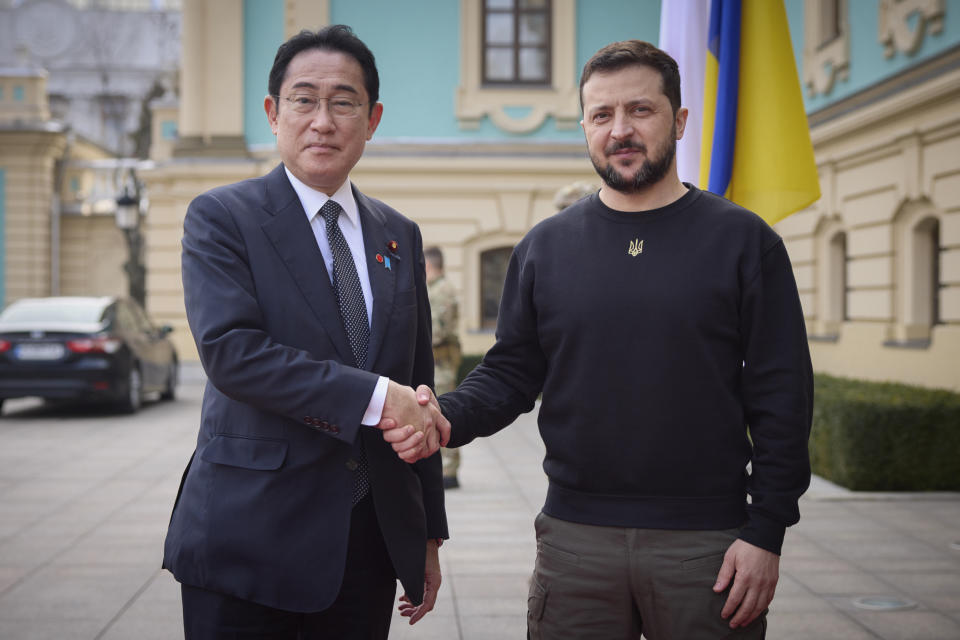 Japanese Prime Minister Fumio Kishida and Ukrainian President Volodymyr Zelenskyy, right, greet each other during their meeting in Kyiv, Ukraine, Tuesday, March 21, 2023. (Ukrainian Presidential Press Office via AP)